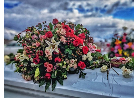 Should I take flowers to a funeral in the UK?