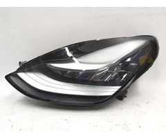 The main left headlight on the Tesla electric car 1077371-10-I